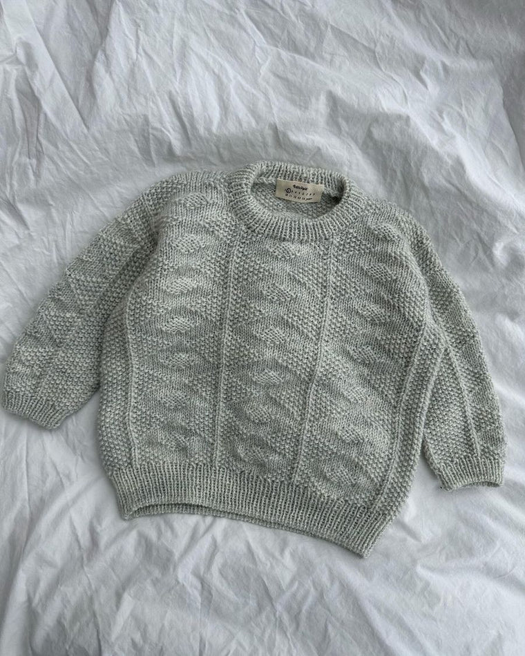 Closeup af rød Esther Sweater Junior
