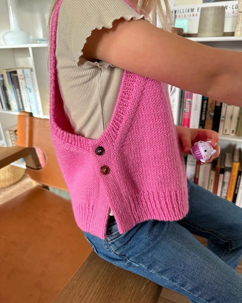Barn iført pink Lulu Slipover Junior 