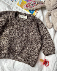 Liggebillede af brun og hvid Melange Sweater Baby