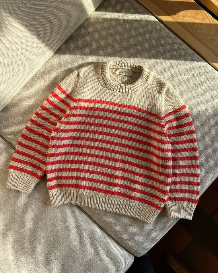 Barn iført hvid og lyserød Lyon Sweater Junior 